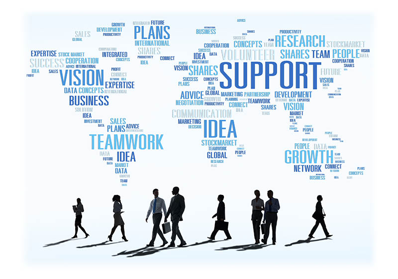 graphic - world map filled with words above business professionals walking